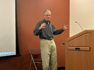 Analyst predicts recession during library talk