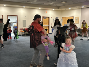Families dress for a library fundraiser