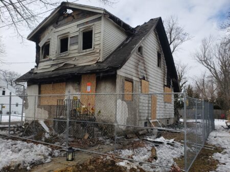 Officials check for smoke alarms after fatal fire